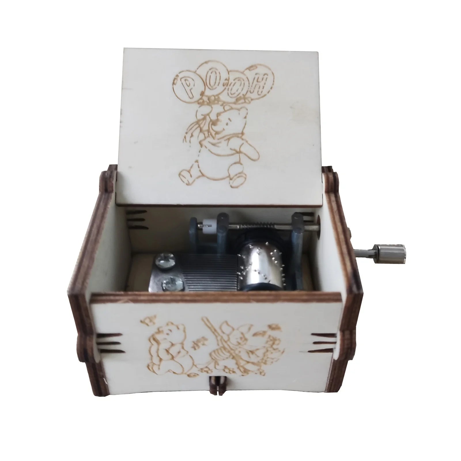 Open wooden Christmas music box with festive Merry Christmas artwork and visible hand-crank mechanism